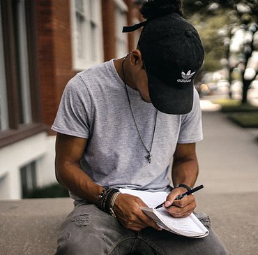 <img src=“rapper.png” alt=“rapper writing beats”>